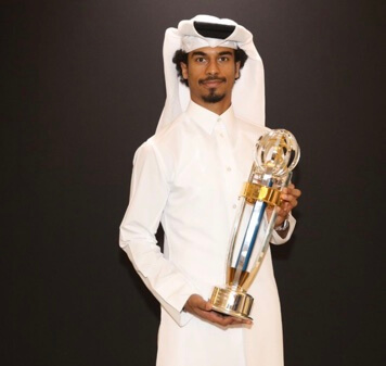 Akram Afif with the trophy. 